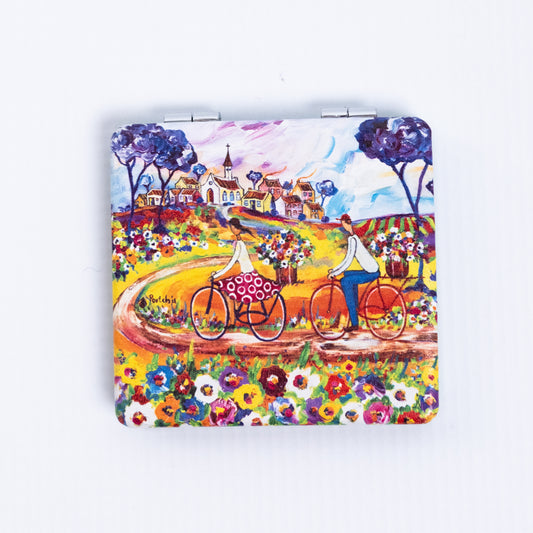 Portchie pocket mirror featuring the Flowers For Aunt Julieta artwork