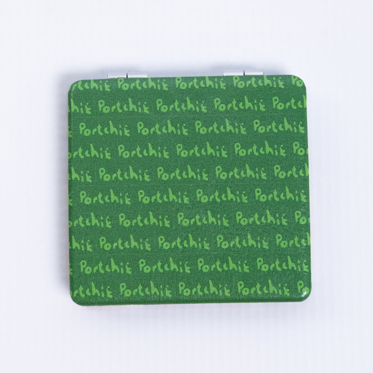 Portchie pocket mirror featuring the Flowers For Aunt Julieta artwork, additional view