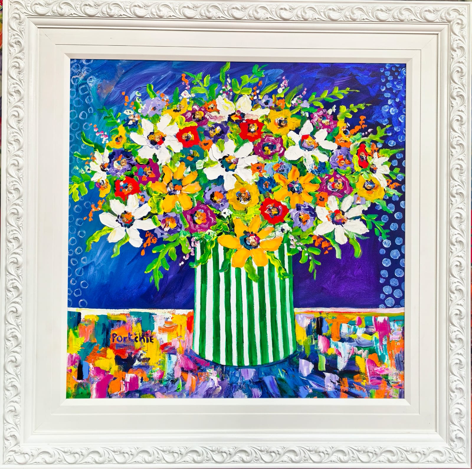 Colourful flowers in a striped Vase
