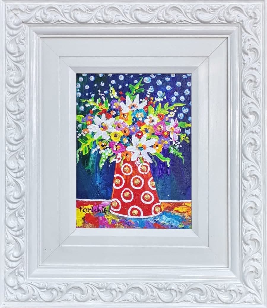 Mixed flowers in a red polka dot Vase