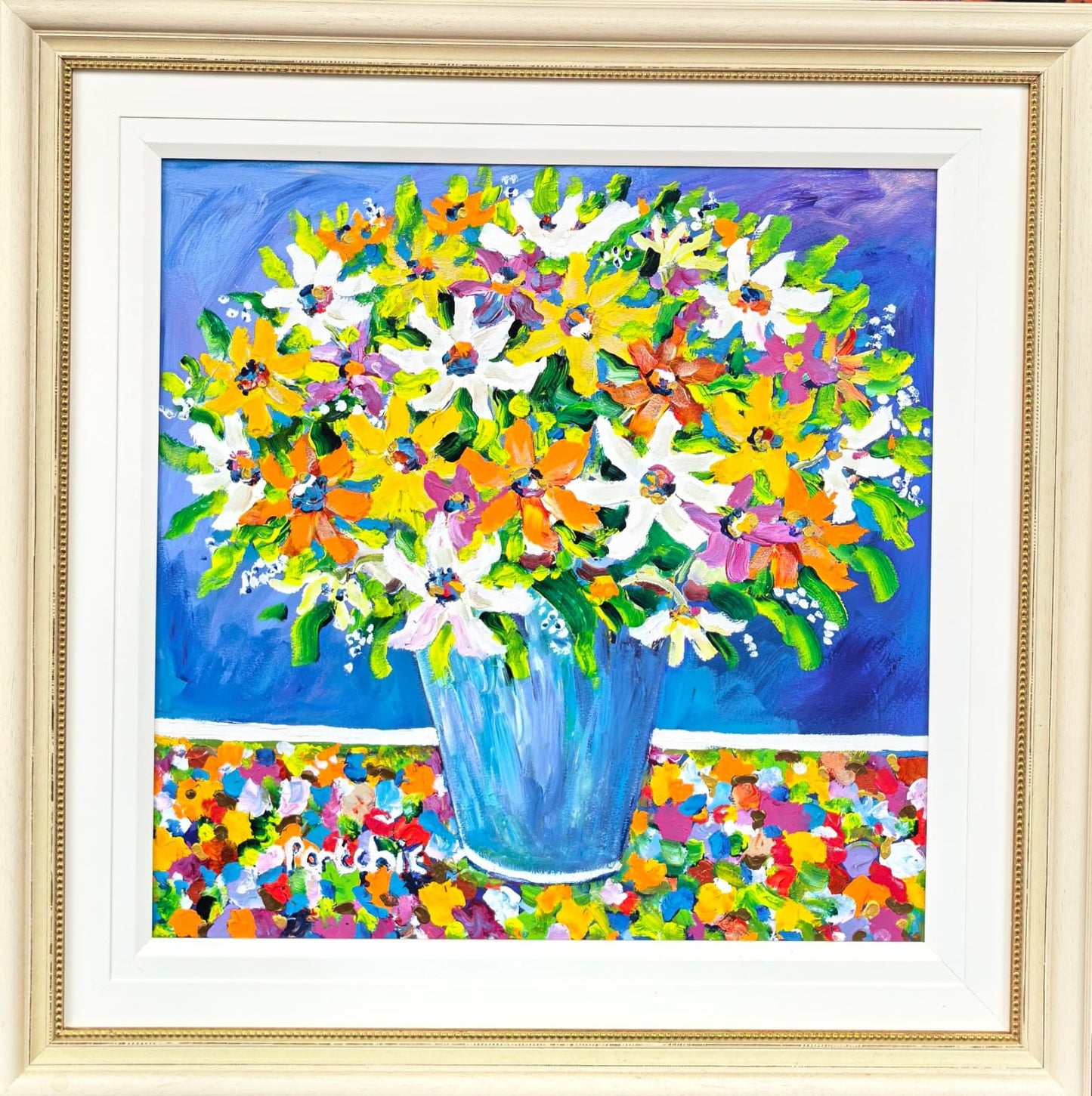 Summer flowers in a blue vase.